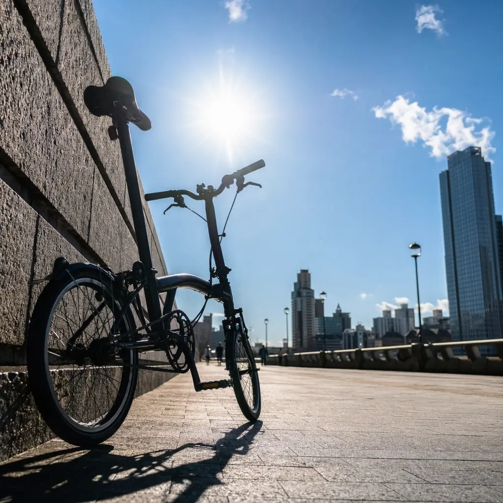 Budget folding bike parked on a sunny urban street, folded and ready for storage