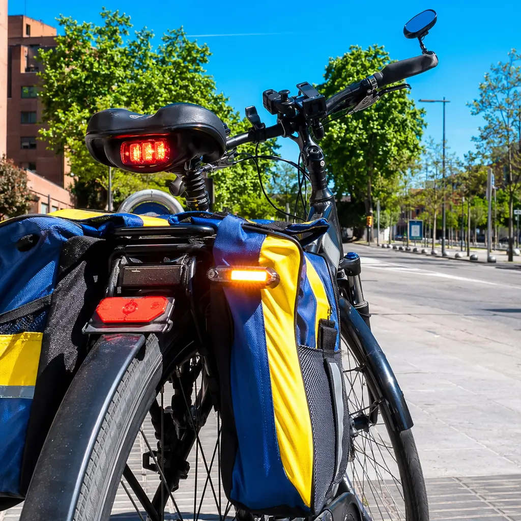 Well-equipped commuter bike in bright sunshine showing safety lights and comfort accessories